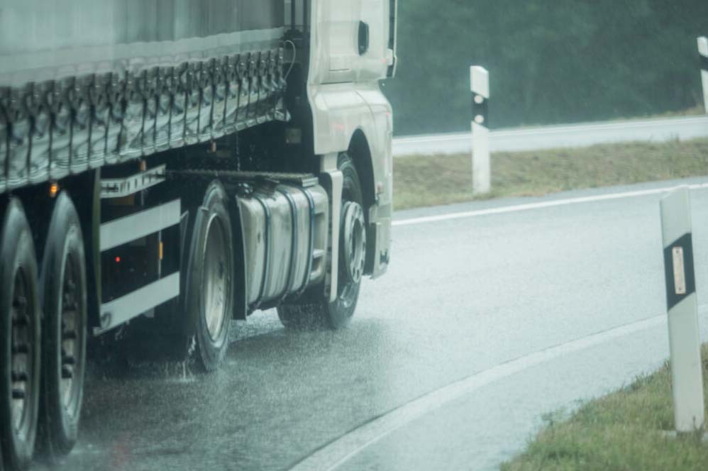 Truck driving in heavy rain.